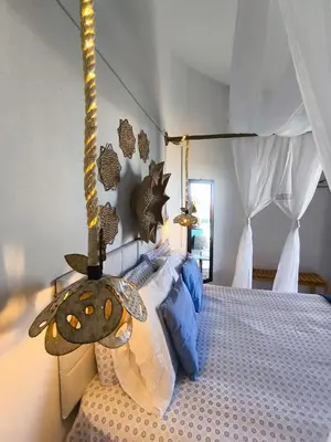 Uma cama ou camas num quarto em Hospedaria Mandacaru