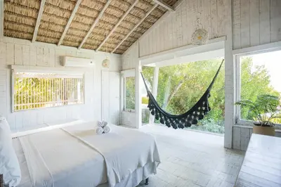 Uma cama ou camas num quarto em Beach Houses Moitas