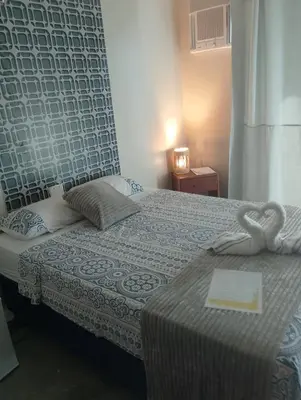 Uma cama ou camas num quarto em Paradise Beach