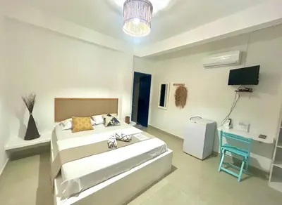 Uma cama ou camas num quarto em Casa boa vida