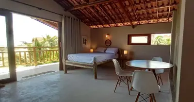 Uma cama ou camas num quarto em Loft Canoa