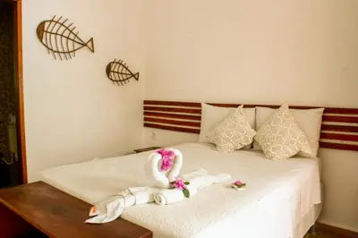 Uma cama ou camas num quarto em Villa Chic Pousada