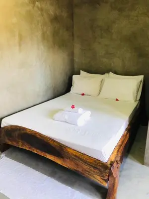 Uma cama ou camas num quarto em Pousada Cavalo Bravo Preá Jeri