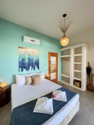 Uma cama ou camas num quarto em Casa Boa onda - Icaraizinho