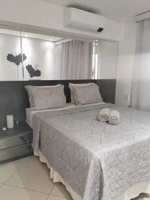 Uma cama ou camas num quarto em Landscape VIP Fortaleza