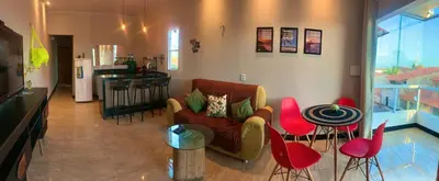 Uma área de estar em Localize casa na praia