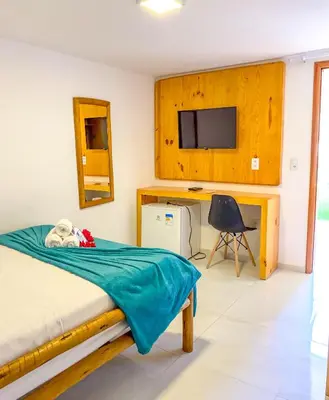 Uma televisão e/ou sistema de entretenimento em POUSADA OBAH VILLAGE