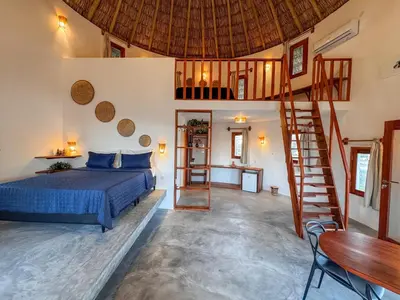 Uma cama ou camas num quarto em VentoVinte Beach Club