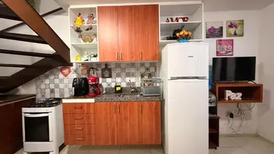 A cozinha ou kitchenette de TRIPLEX SOLAR CASA BRANCA