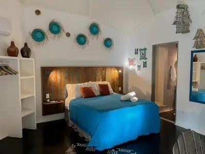Uma cama ou camas num quarto em Casa Zulu - Vila Umoya