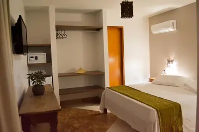 Uma cama ou camas num quarto em Pousada Maresias do Cumbuco