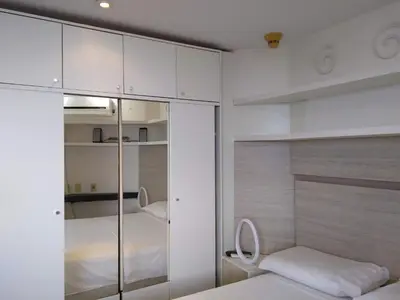 Uma cama ou camas num quarto em Flat particular no Blue Tree Fortaleza