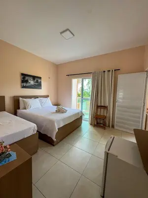 Uma cama ou camas num quarto em Pousada dos Corais