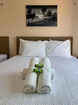 Uma cama ou camas num quarto em Pousada dos Corais
