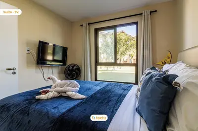 Uma cama ou camas num quarto em Apartamento térreo VG Sun Cumbuco por Tactu