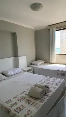 Uma cama ou camas num quarto em Flat Beira Mar Fortaleza