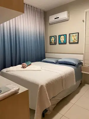 Uma cama ou camas num quarto em ECO FLECHEIRAS RESIDENCE