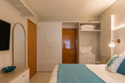 Uma cama ou camas num quarto em ECO FLECHEIRAS RESIDENCE