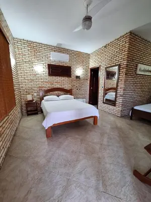 Uma cama ou camas num quarto em Pousada Solar das Fontes