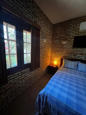 Uma cama ou camas num quarto em Pousada Solar das Fontes