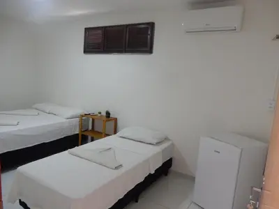 Uma cama ou camas num quarto em Pousada Ah Mar