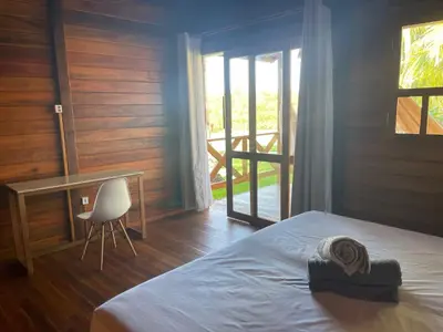Uma cama ou camas num quarto em Pousada Wind Rose