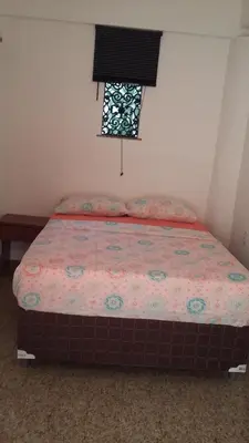 Uma cama ou camas num quarto em Hospedaria Chez Nous