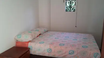 Uma cama ou camas num quarto em Hospedaria Chez Nous