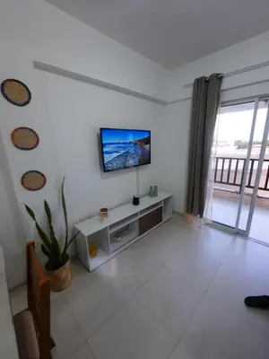Uma televisão e/ou sistema de entretenimento em Cumbuco Residencial Dunas Beach apt.203
