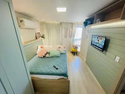 Uma cama ou camas num quarto em Flat Luxuoso Alto Padrao Frente Mar com 2 suites no Iate Plaza