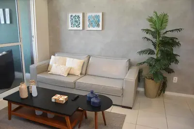 Uma área de estar em TERRAMARIS DUPLEX LUXO - FRENTE MAR