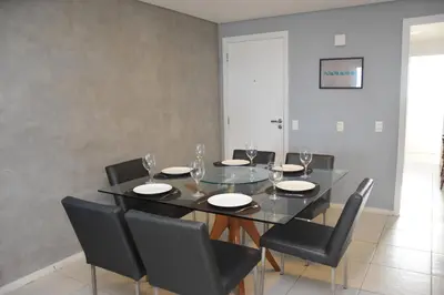 Uma área de estar em TERRAMARIS DUPLEX LUXO - FRENTE MAR