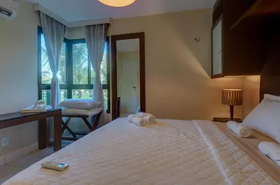 Uma cama ou camas num quarto em VG Sun #102 - Apto de Dois Quartos por Carpediem