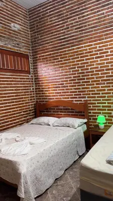 Uma cama ou camas num quarto em Pousada Paraíso das Falésias