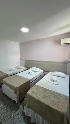 Uma cama ou camas num quarto em Flat Atlântico Neto