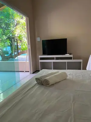 Uma cama ou camas num quarto em Chalés toca do guaxinim