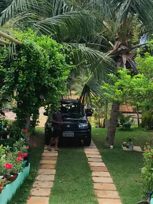 Um jardim no exterior de Vila Coqueiro - Moitas