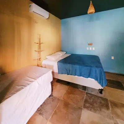 Uma cama ou camas num quarto em Vila Coqueiro - Moitas