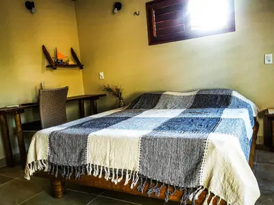 Uma cama ou camas num quarto em Sítio Boralá