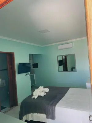Uma cama ou camas num quarto em Pousada Maanain