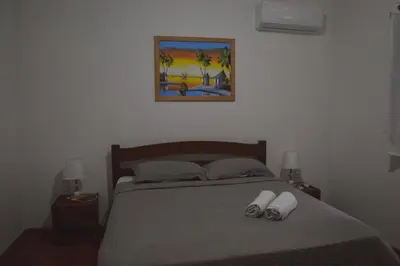 Uma cama ou camas num quarto em Apartamentos da Jangada