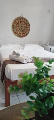Uma cama ou camas num quarto em Pousada Roane - Taíba