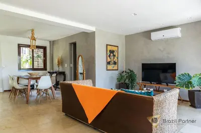 Uma televisão e/ou sistema de entretenimento em Apartamento 3 Suítes - Completo - Praia da Taíba