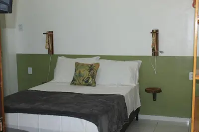 Uma cama ou camas num quarto em Villa Encantos do Paraíso 50mts da lagoa