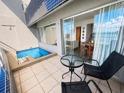 A piscina em ou perto de Hosts BR - Cobertura duplex frente mar