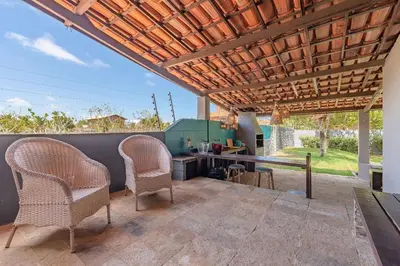 Uma área de estar em Casa na Praia Porto das Dunas - Próximo ao Beach Park by Carpediem