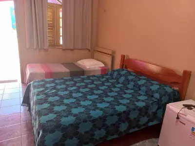 Uma cama ou camas num quarto em Pousada Rio e Mar