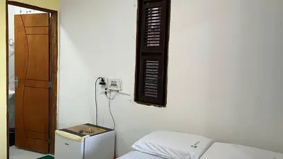 Uma cama ou camas num quarto em Cantinho GL