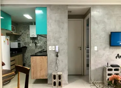 A cozinha ou kitchenette de Apartamento Na Praia - VG FUn residence