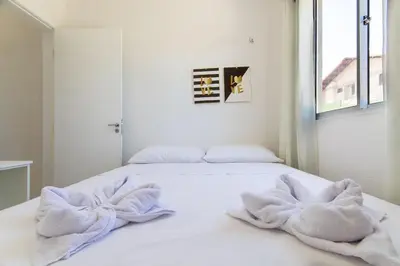 Uma cama ou camas num quarto em Beach Townhouses #C5 - Aconchego por Carpediem